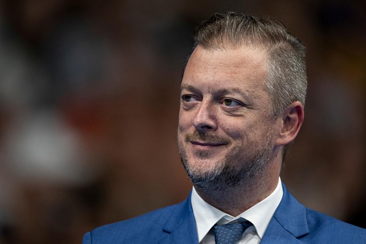 Andrew Parsons, IPC president, looks to his right